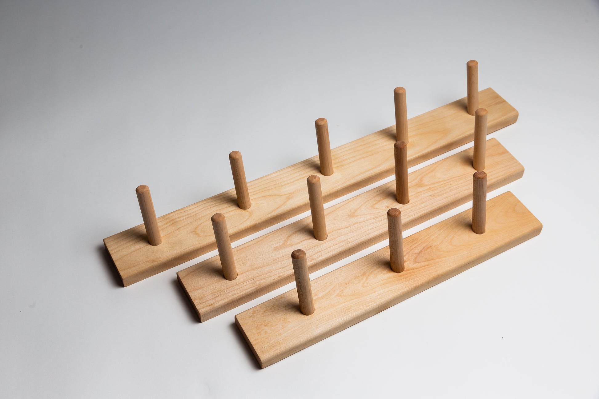 3 sizes of birch wooden coat racks.